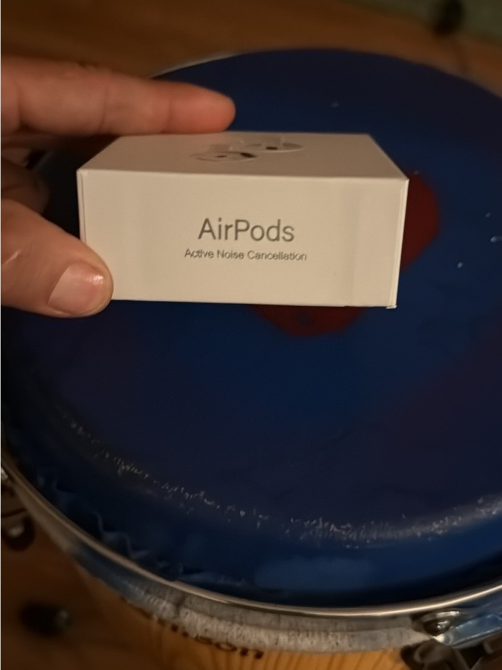 Apple Earbuds Packaging with White Box and Blue Tray